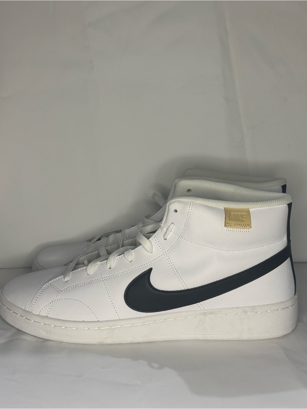 Nike Men’s White High-Top Sneakers with Black Swoosh and Tan Tag